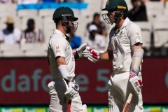 MELBOURNE, AUSTRALIA - DECEMBER 26: Joe Burns of Australia and Matthew Wade of Australia bump fists during day one of the Second Vodafone Test cricket match between Australia and India at the Melbourne Cricket Ground on December 26, 2020 in Melbourne, Australia. (Photo by Dave Hewison/Speed Media/Icon Sportswire)