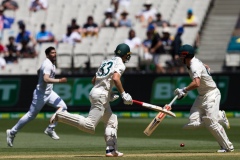 MELBOURNE, AUSTRALIA - DECEMBER 26: Travis Head of Australia and Marnus Labuschagne of Australia take a run  during day one of the Second Vodafone Test cricket match between Australia and India at the Melbourne Cricket Ground on December 26, 2020 in Melbourne, Australia. (Photo by Dave Hewison/Speed Media/Icon Sportswire)