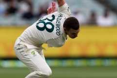MELBOURNE, AUSTRALIA - DECEMBER 27: Josh Hazlewood of Australia stretches on the field during day two of the Second Vodafone Test cricket match between Australia and India at the Melbourne Cricket Ground on December 27, 2020 in Melbourne, Australia. (Photo by Dave Hewison/Speed Media/Icon Sportswire)