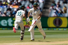 MELBOURNE, AUSTRALIA - DECEMBER 29: Cameron Green of Australia and Pat Cummins of Australia take a run during day four of the Second Vodafone Test cricket match between Australia and India at the Melbourne Cricket Ground on December 29, 2020 in Melbourne, Australia. (Photo by Dave Hewison/Speed Media/Icon Sportswire)